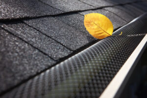 Micro-mesh gutter guard over gutter on a roof 