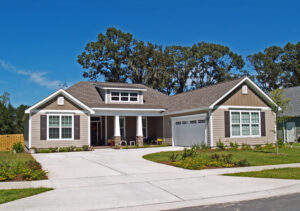 Single-story home with garage and tan siding