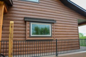 Home with brown steel log siding